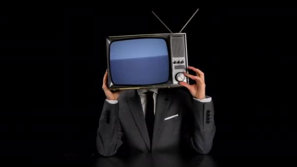 Man wearing suit with TV on head — Stock Video