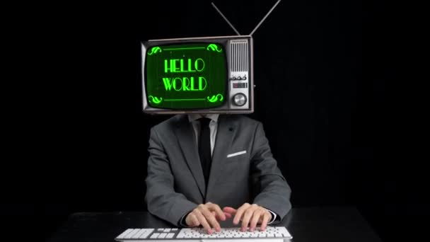 Homem digitando com TV na cabeça e Olá mensagem do mundo — Vídeo de Stock