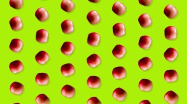 Kırmızı elmalar yeşil arkaplanda canlandırıldı