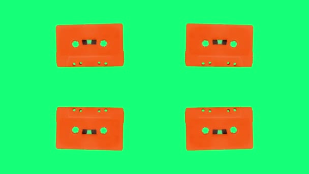 Kassettenband bewegt sich gegen verschiedene Farben — Stockvideo