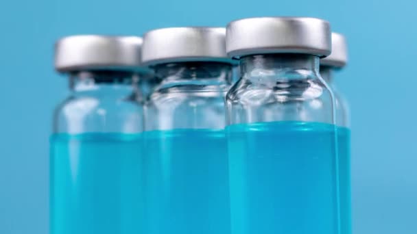 Glass vials of with blue coloured liquid — Stock Video