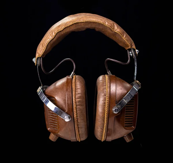 Vintage headphones against black background — Stock Photo, Image