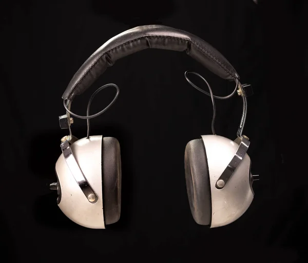 Vintage headphones against black background — Stock Photo, Image