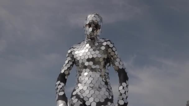 Sparkling discosuit man dancing with clouds behind — Stock Video