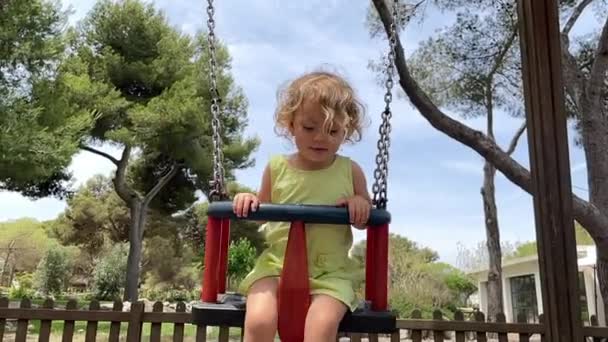 Girl in swing — Stock Video
