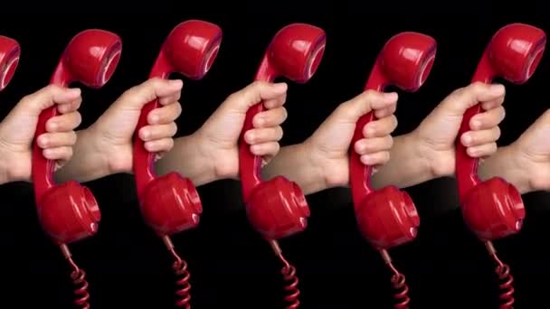 Hands holding red phones — Stock Video