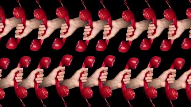 Hands holding red phones — Stock Video