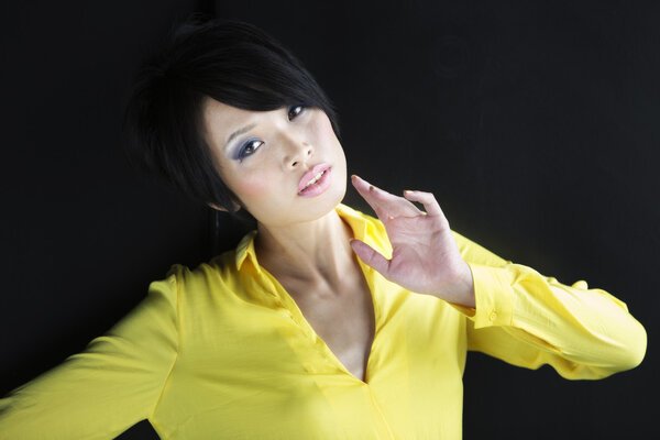 Asian woman in yellow shirt