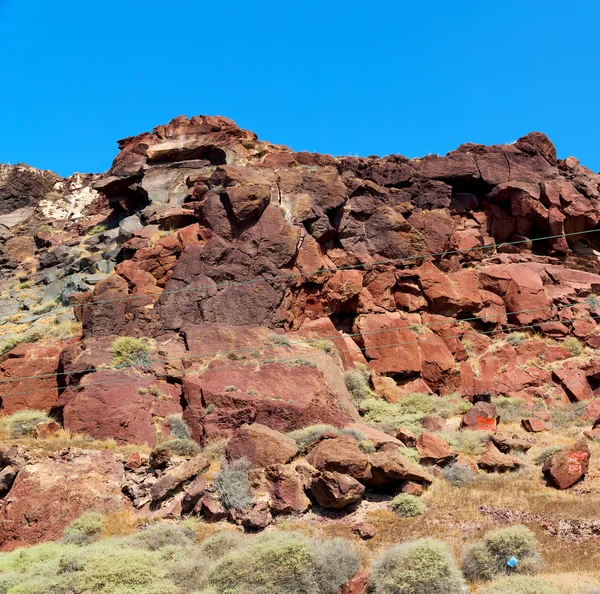 Rock alone in the sky santorini europe greece and dry bush — Stock Photo, Image