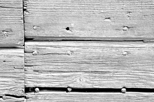 Textura abstrata de uma antiga porta velha de madeira marrom em itália e — Fotografia de Stock