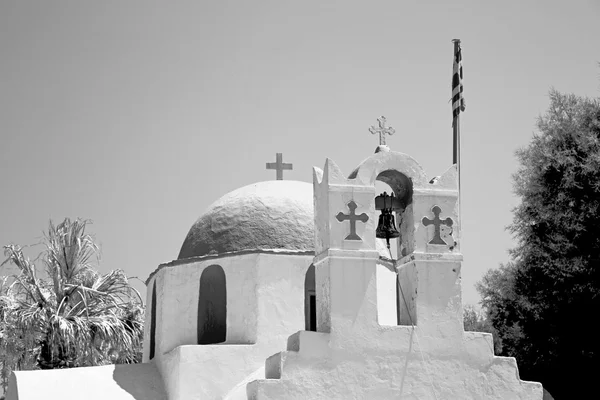 In cyclades      europe greece a cross the cloudy sky and bell — Stock Photo, Image