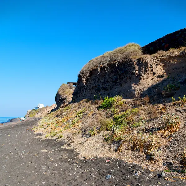 Rocher seul dans le ciel santorini europe greece et buisson sec — Photo