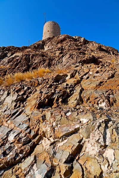 In oman muscat rock  the old defensive  fort battlesment sky and — Stock Photo, Image