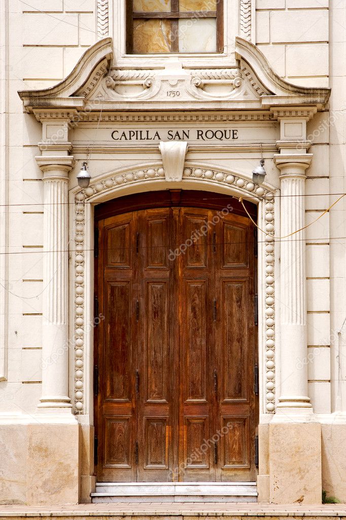 brown wood old door of a church capilla san roque 
