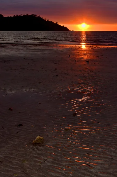 Little stone in the sunset's ocean — Stock Photo, Image