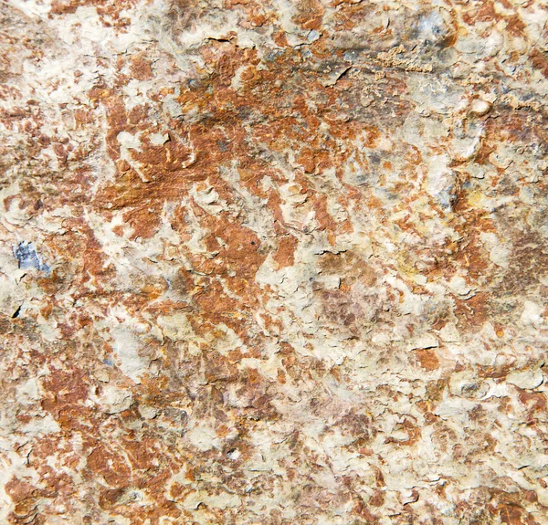 Piedras piedra y gneis rojo anaranjado en la pared de morocco — Foto de Stock