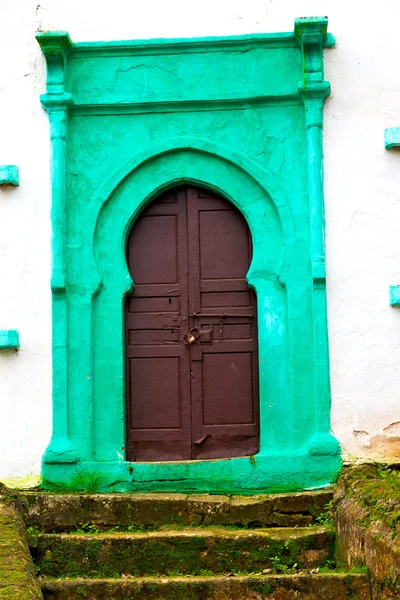 Old door in morocco  and wall ornate green — Stock Photo, Image