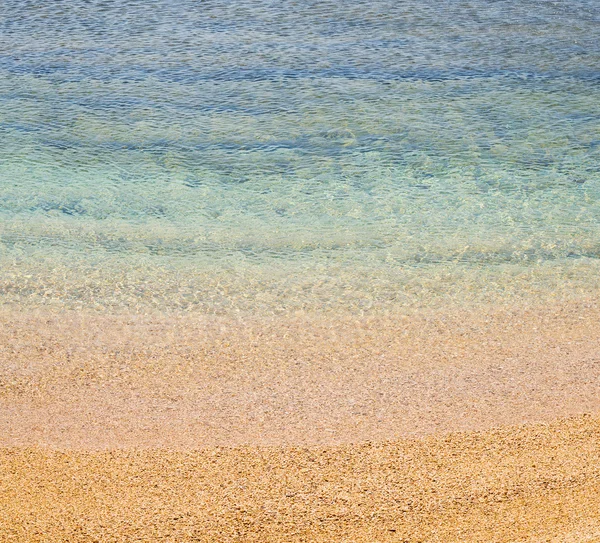 Espuma de marea y espuma en el mar de — Foto de Stock