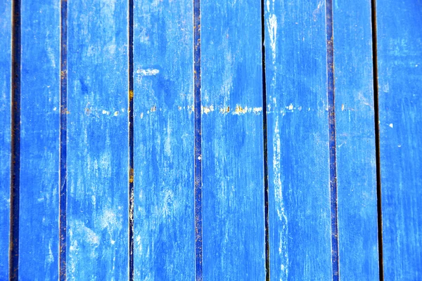 Stripped  in the blue door and rusty nail — Stock Photo, Image