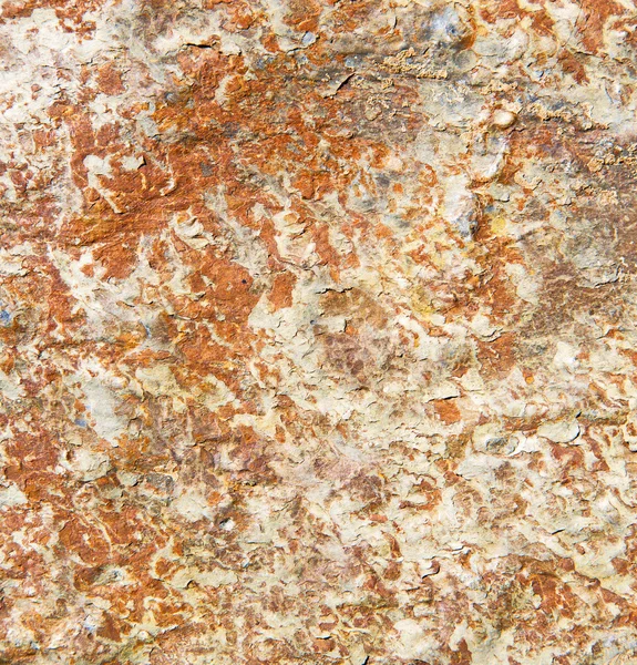 Piedras piedra y gneis rojo anaranjado en la pared de morocco — Foto de Stock