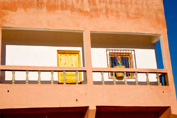 Blue window in morocco africa old construction and brown wall construction