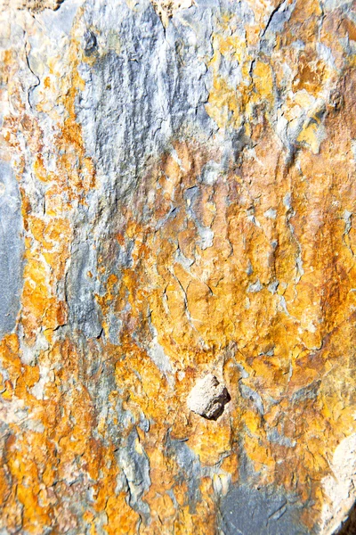 Pedras de pedra e laranja gnaisse na parede de morocco — Fotografia de Stock