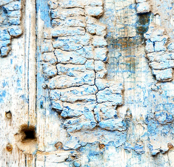 Metal nail dirty stripped paint in the brown wood door and rusty — Stock Photo, Image