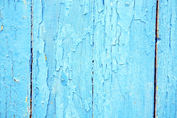 dirty stripped paint  the blue wood door and