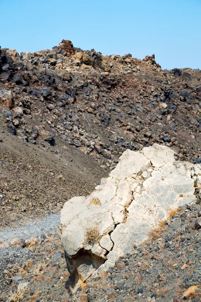 Vulkanische grond in santorini hemel en — Stockfoto