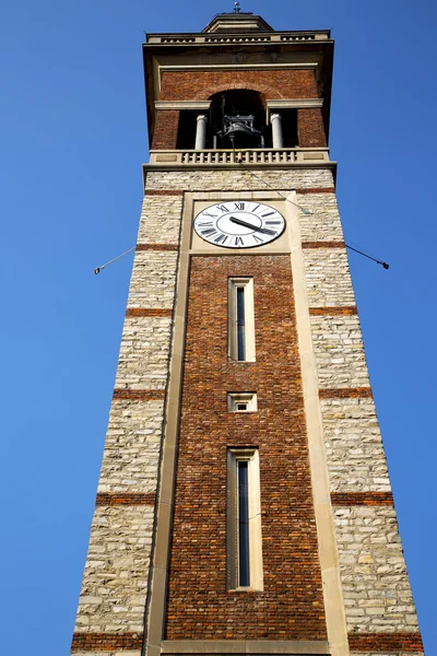 Em gorla velho abstrato itália a torre de parede sino ensolarado — Fotografia de Stock