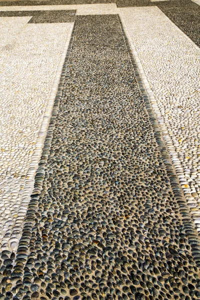 In   castano primo  street l   pavement of a curch and marble — Stock Photo, Image