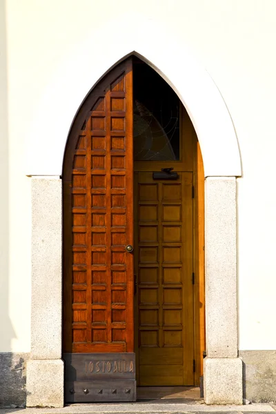 El taino oxidado en una puerta rizo cerrado madera italia lombardía — Foto de Stock