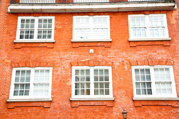 In europe london old red brick wall and historical window