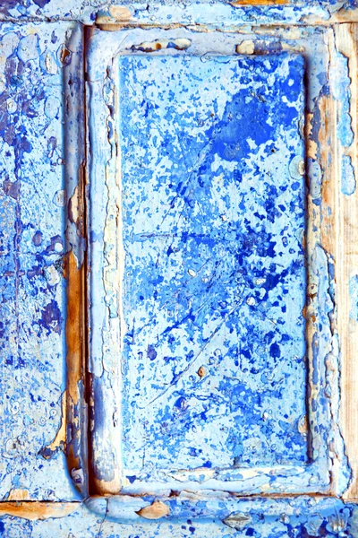 Nail stripped paint in the blue door and rusty — Stock Photo, Image