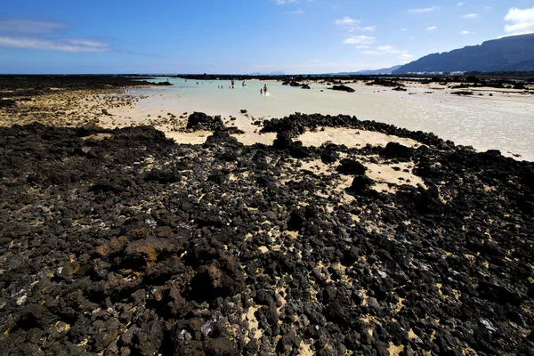 Pessoas espanha colina branco praia espiral preto lanzarote — Fotografia de Stock