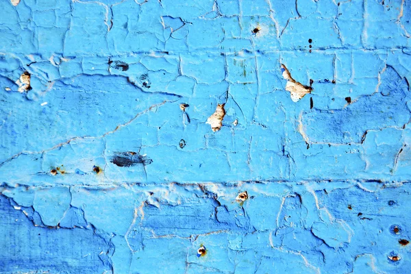 Брудна фарба в синіх дверях іржавий цвях — стокове фото