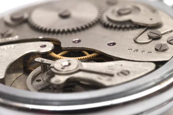 Mecanismo de reloj en el fondo blanco — Foto de Stock