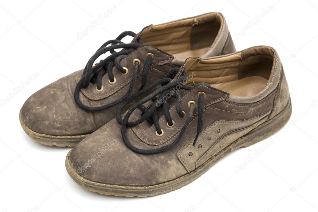 Dirty shoes on the white background Stock Photo by ©antonsov85 76704645