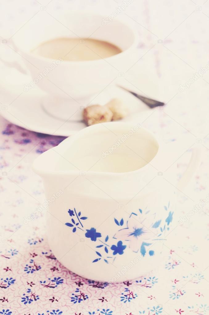 Vintage milk jug, table served for morning coffee