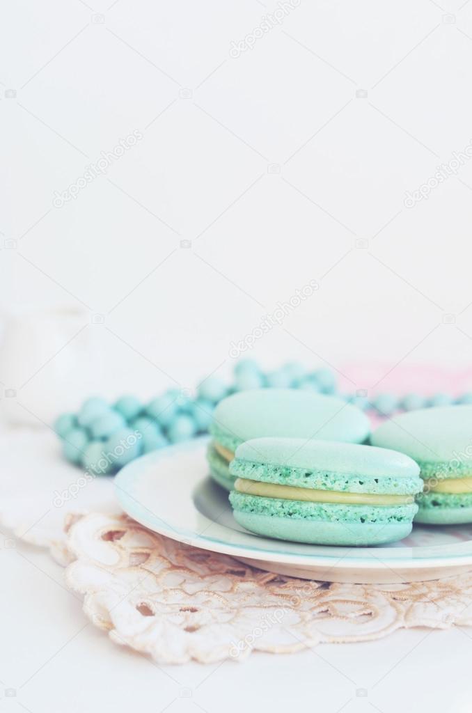 Backdrop with mint macaroon on light background