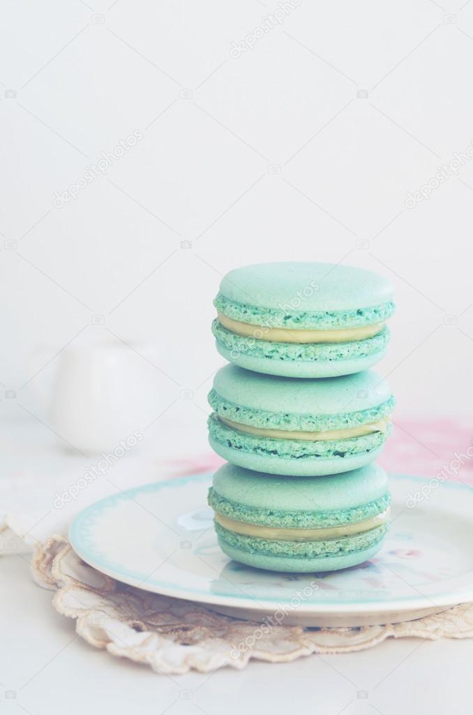 Backdrop with mint macaroon on light background