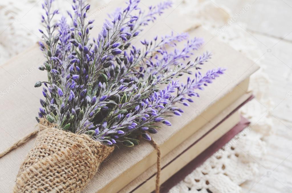 Bunch of lavender placed on book bundle