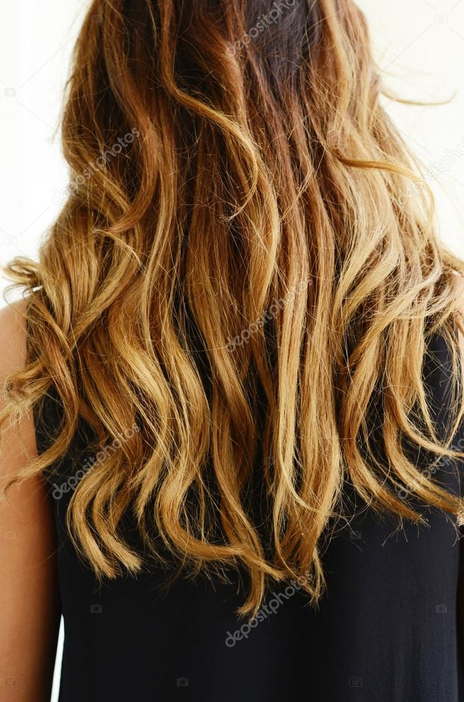Woman In Black Dress With Wavy Hair Back View Stock Photo