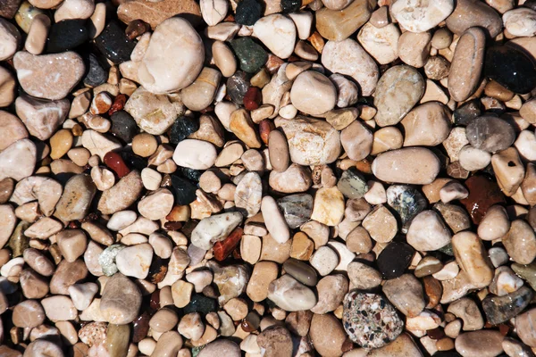 Piedras en la playa y el agua de mar —  Fotos de Stock