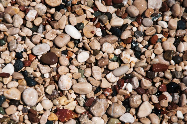 Piedras en la playa y el agua de mar —  Fotos de Stock