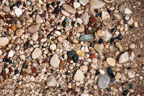 Stones on beach and sea water — Stock Photo, Image