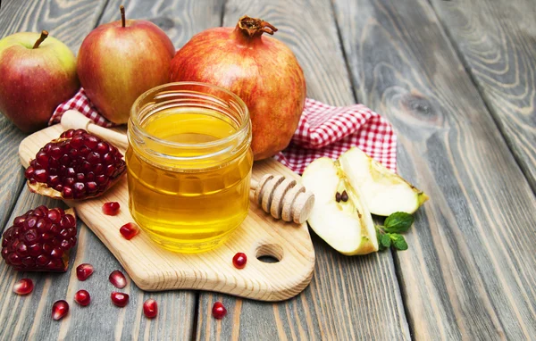 Eple og granatepler av honning – stockfoto