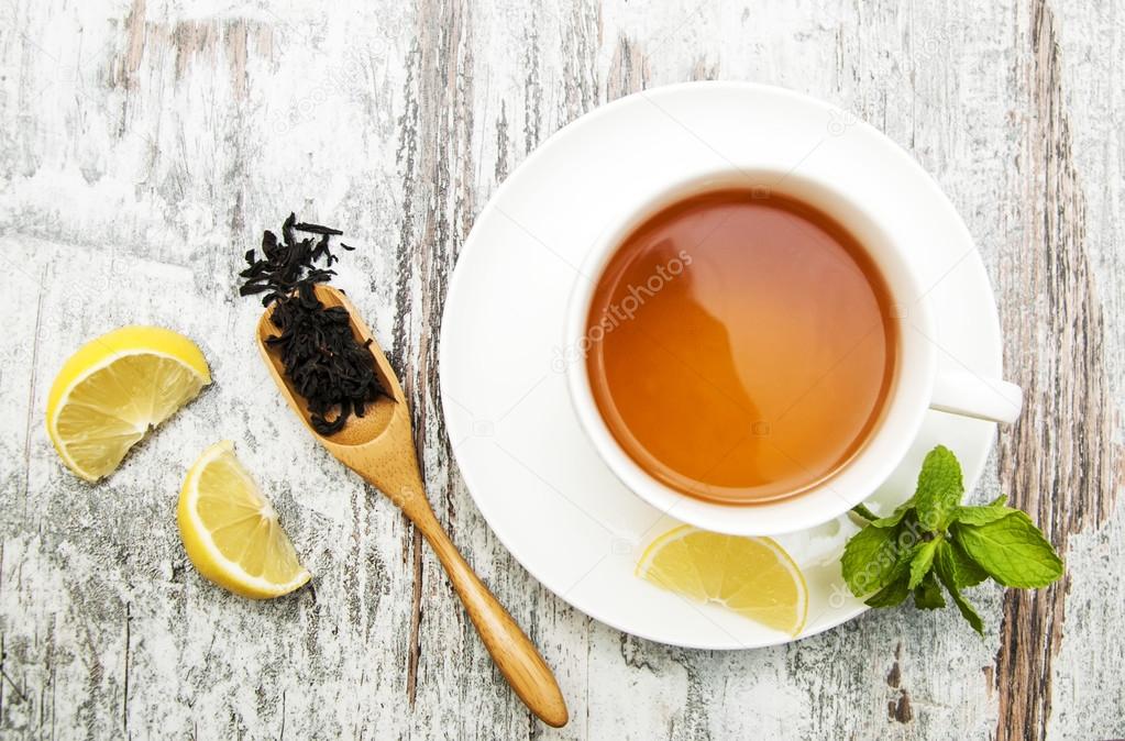 Cup of tea with lemon and mint 