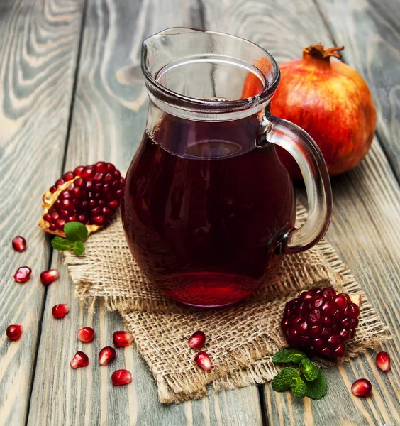 Pitcher of pomegranate juice — Stock Photo, Image