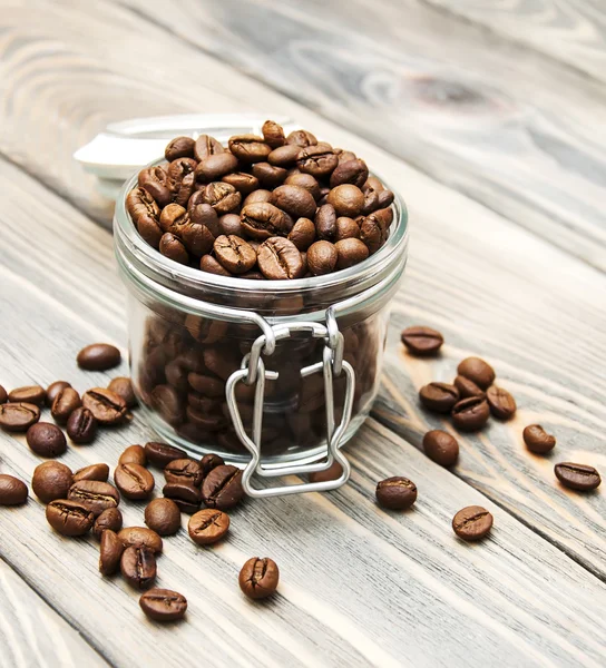 Glass jar full of coffee beans — Stock Photo, Image